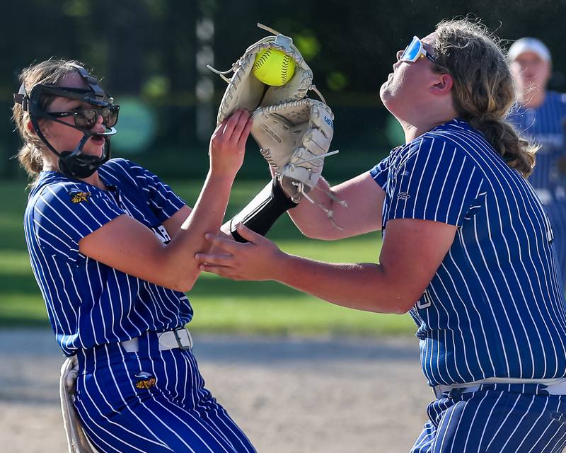 Newark's Kodi Rizzo (L) and Kate Bromeland (19) collide while attempting to catch a pop up during Class 1A Newark Regional final game between St. Edwards at Newark. May 17th, 2024.