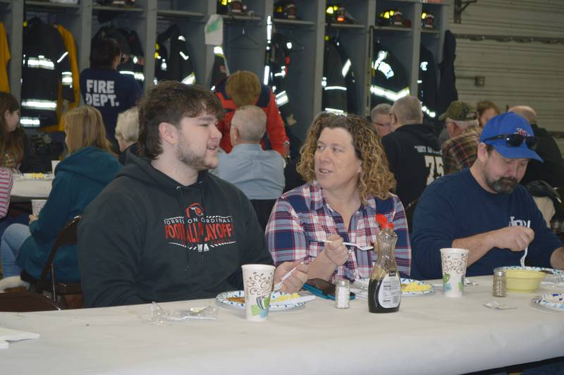 Zac Shuman, left, talks with his mother, Amy Shuman, of Leaf River, on Feb. 25, 2023, during the annual Leaf River Firemen's Pancake Supper. A little over 700 people attended the fundraiser at the Leaf River fire station, raising $2,050.