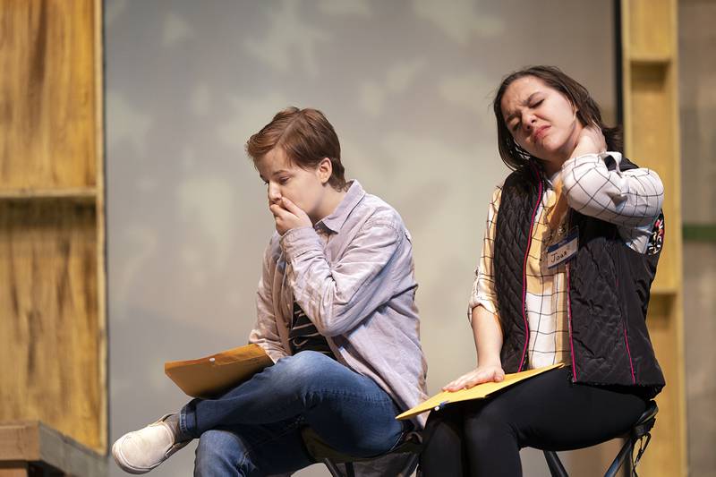 Rileigh Wren (left) and Michelle Henderson act out a scene during rehearsal Wednesday, March 15, 2023 for their contest play ahead of this weekend’s drama sectionals.