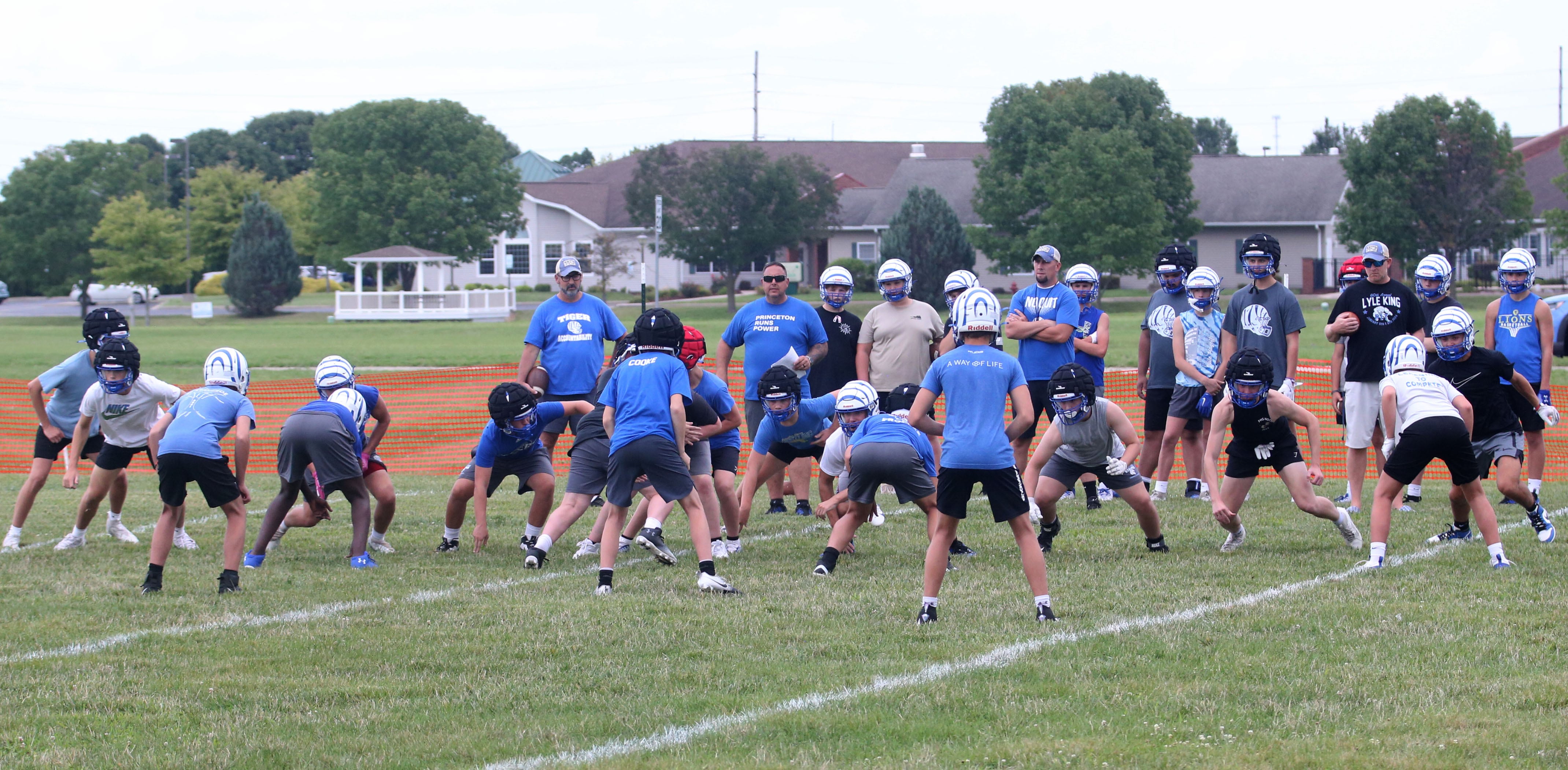 Members of the Princeton football team run drills during the first day of football practice on Monday, Aug. 12, 2024 at Little Siberia Field in Princeton.