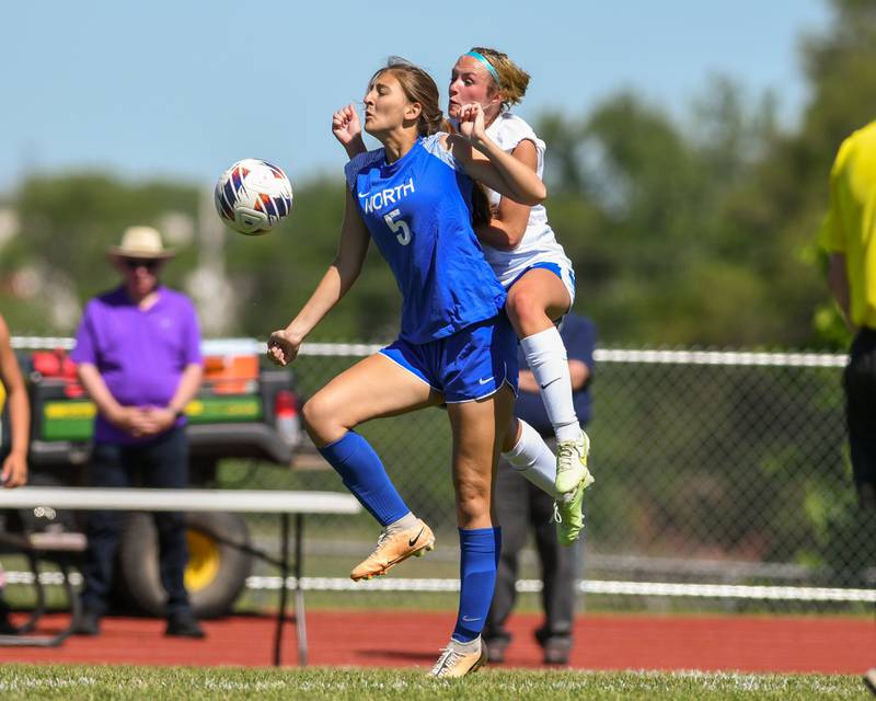 Wheaton North's Olivia Galbraith (5) and St. Charles North's Keira Kelly (8) go up to head the ball during the sectional title game held on Saturday May 25, 2024 held at South Elgin High School.