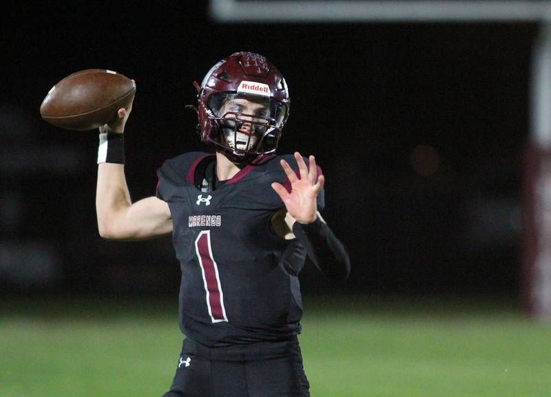 Marengo’s David Lopez passes the ball against Richmond Burton in varsity football at Rod Poppe Field on the campus of Marengo High School in Marengo on Friday, Oct. 18, 2024.