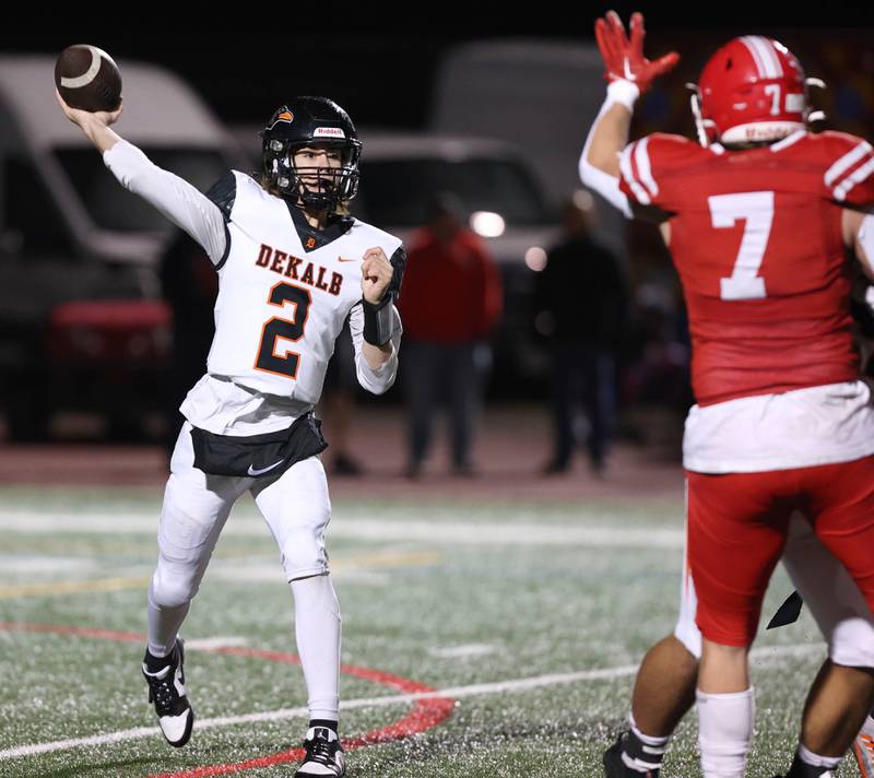 DeKalb's Cole Latimer throws a pass over Naperville Central's Christian Kuta during their game Friday, Oct. 6, 2023, at Naperville Central High School.