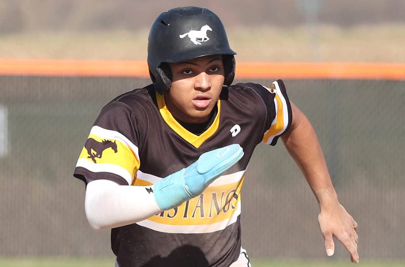 Metea Valley's Jayden Malone hustles to third during their game against DeKalb Thursday, April 13, 2023, at DeKalb High School.