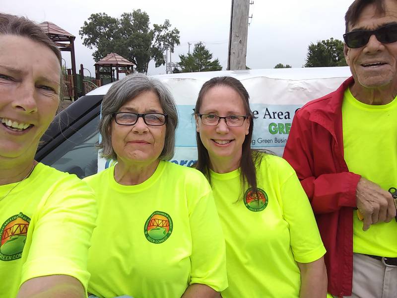 Yorkville Green Connect volunteers Stephanie Roskopf (far left), Patty P. (second to left), Renee Kryger (second to right), and Don Puffy (far right) join after cleaning up Yorkville's streets of debris and litter.