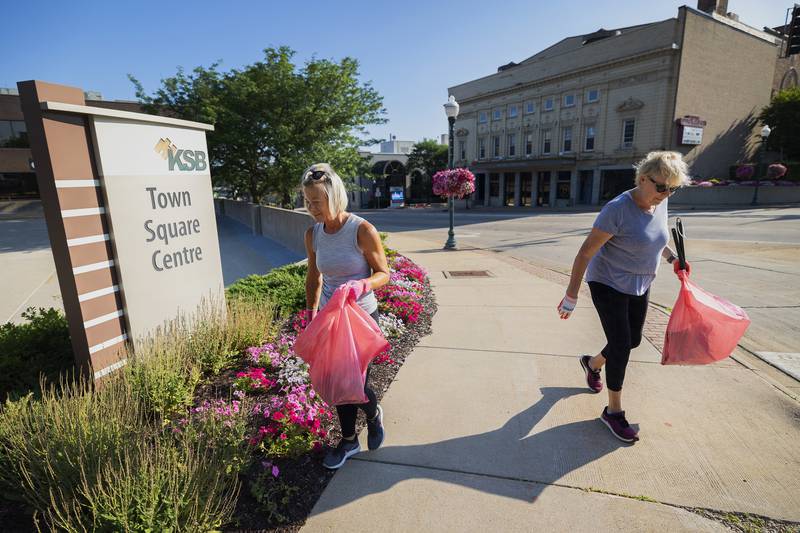 Sue Bennett (left) and Linda Loescher look for litter along Galena Avenue in Dixon Thursday, July 6, 2023 while on refuse patrol. Loescher’s son joked with mom about the volunteers bering a “chain gang.”