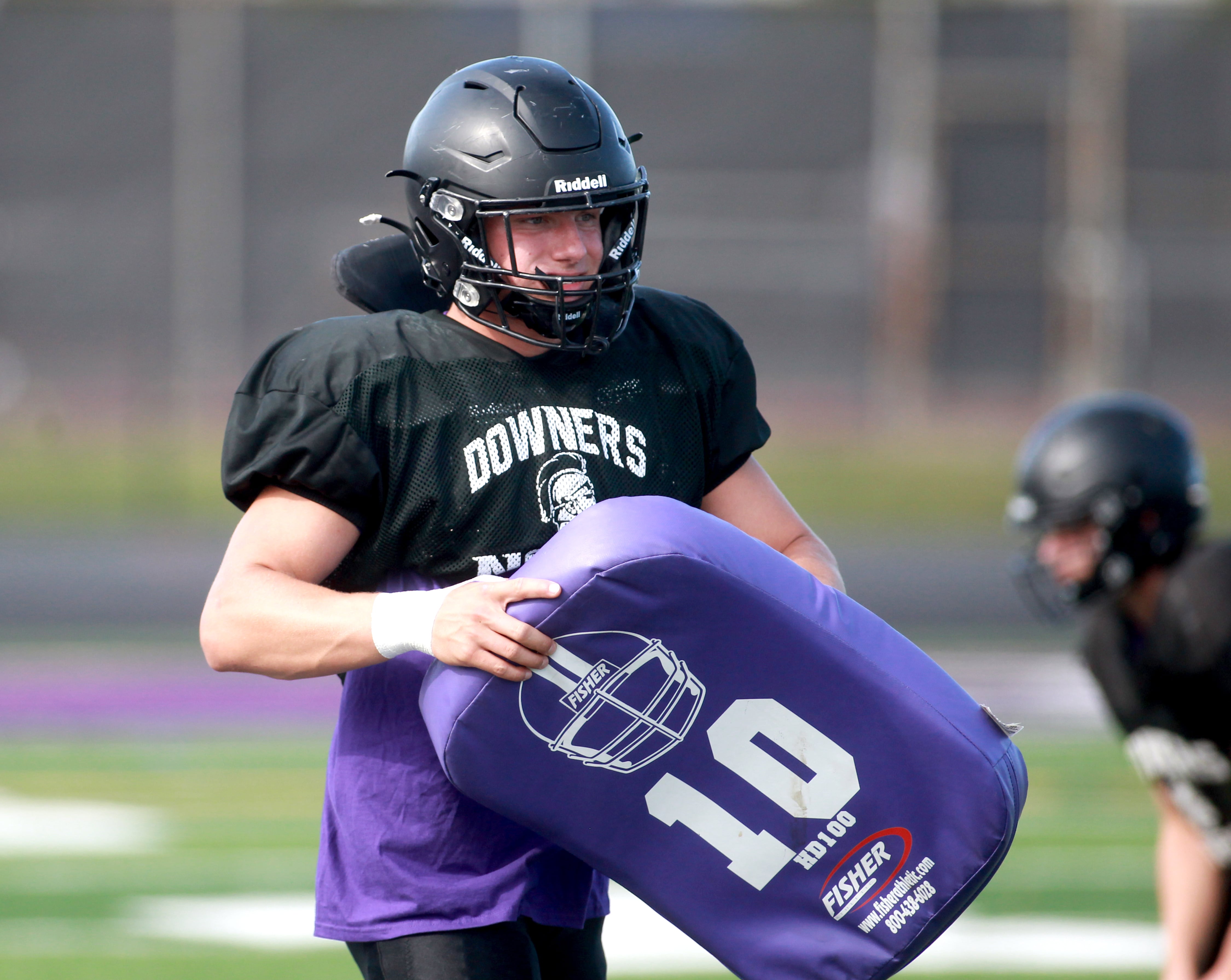 Downers Grove North’s Jake Gregorio works out with the linemen during a practice on Tuesday, Aug. 20, 2024 at the school.