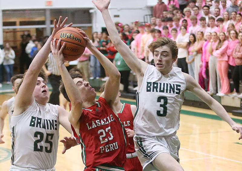 L-P's Nicholas Olivero eyes the hoop as St. Bede's Jake Miglorini and Alex Ankiewicz defend on Wednesday, Feb. 14, 2024 at St. Bede Academy.