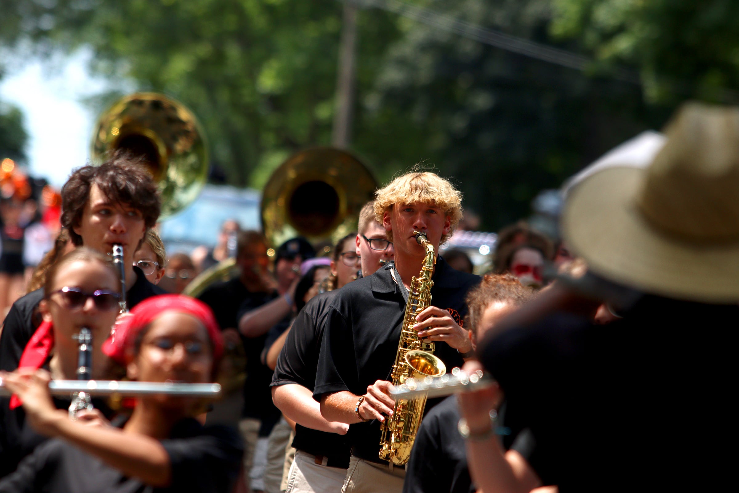 The McHenry High School Warriors Marching Band performs as part of the Fiesta Days parade along Main Street in McHenry Sunday.