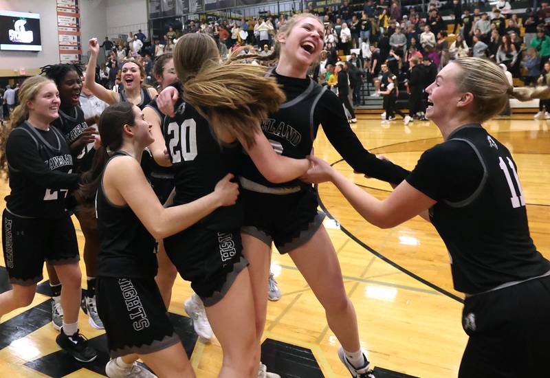 Kaneland players celebrate their win over Sycamore in their Class 3A sectional semifinal Tuesday, Feb. 20, 2024, at Sycamore High School.