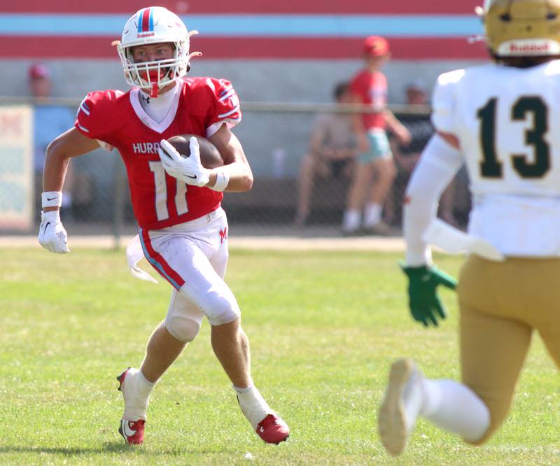 Marian Central’s Maxwell Kinney runs the ball against Bishop McNamara in varsity football action on Saturday, Sept. 14, 2024, at George Harding Field on the campus of Marian Central High School in Woodstock.