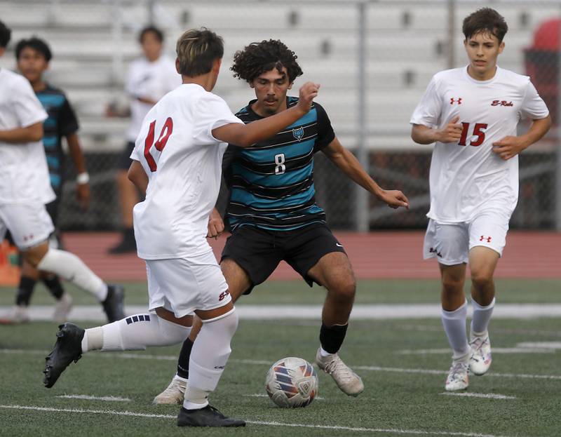 Woodstock North's Cesar Salas tries to control the ball as he is defended by Rockford East's Samuel Vargas during a nonconference soccer match on Thursday, Sept. 5, 2024, at Huntley High School.