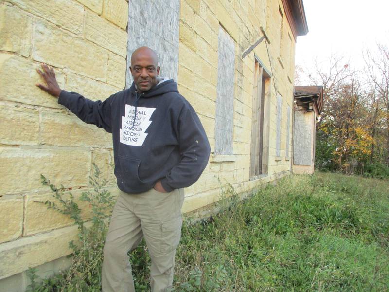 Luther Johnson stands outside the Casseday house in Joliet. Johnson wants to convert the 1851 building into a museum depicting local African American history and African American contributions to the U.S. military. Nov. 9, 2021.