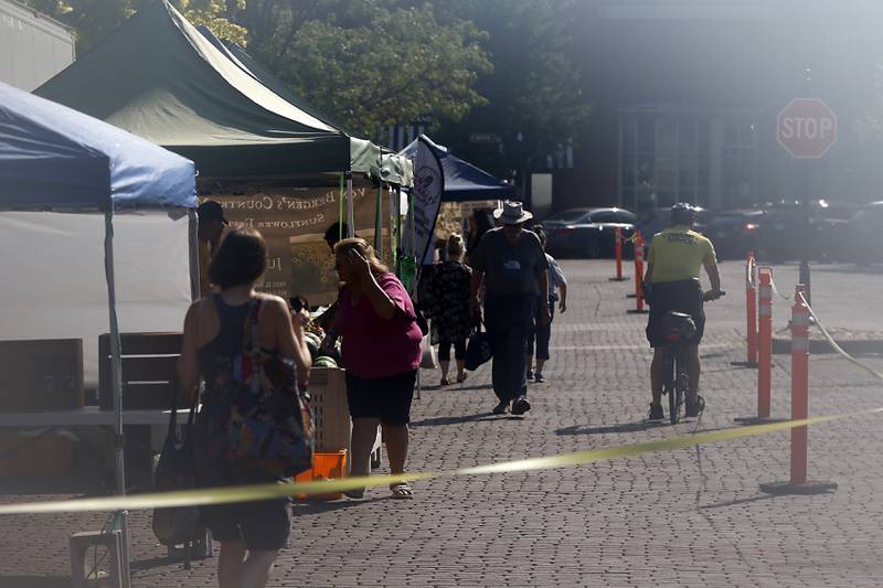 A little bit of lens fog creates a steamy view of the Summer Woodstock Farmers Market around the Historic Woodstock Square. People were able to shop from over 40 of their favorite farms & producers for in-season food fresh produce, dairy, meats, breads, baked goods, spices, herbs, pasta, flowers and more.