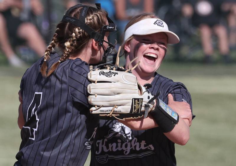 Kaneland's Isabelle Stombres (right) is congratulated after a diving catch in center field by Natalie Naab during their Class 3A sectional semifinal against Sycamore Thursday, May 30, 2024, at Sycamore High School.