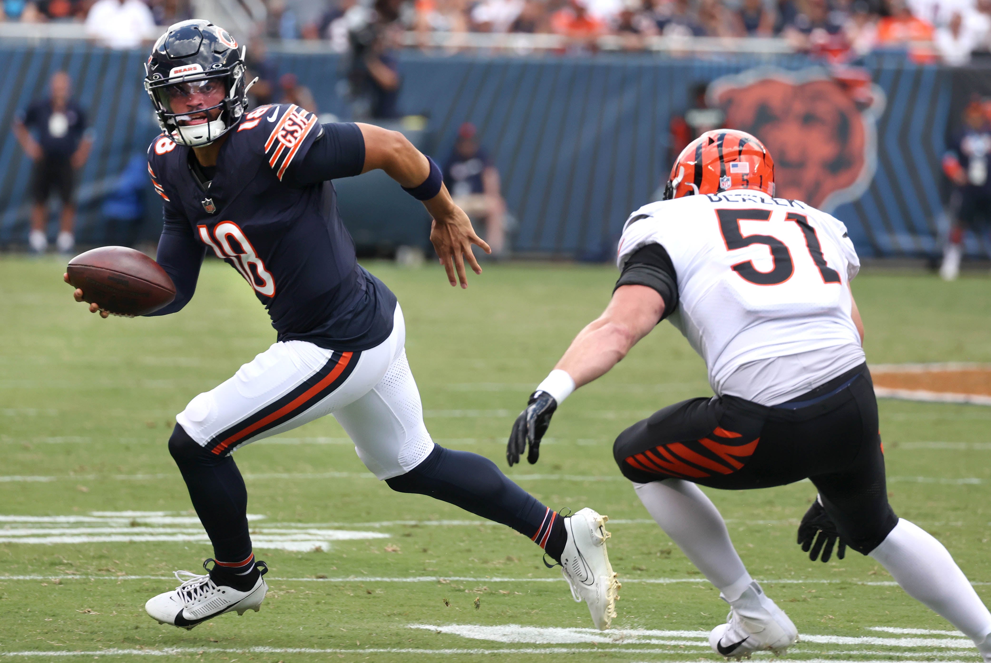 Chicago Bears quarterback Caleb Williams escapes the rush of Cincinnati defensive end Justin Blazek during their game Saturday, Aug. 17, 2024, at Soldier Field in Chicago.