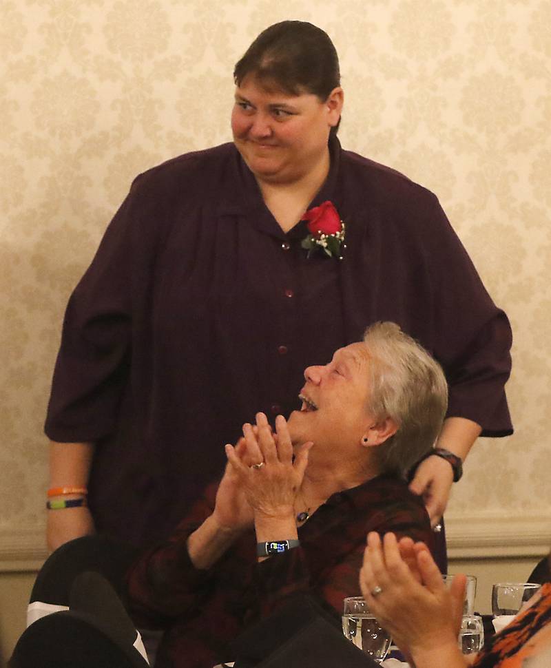 Jan Welch claps  for Renae St. Clair of Huntley High School as she is named the  2023 Educator of the Year during the the Educator of the Year Dinner, Saturday, May 6, 2023, at Hickory Hall, in Crystal Lake. The annual awards recognize McHenry County’s top teachers, administrators and support staff.