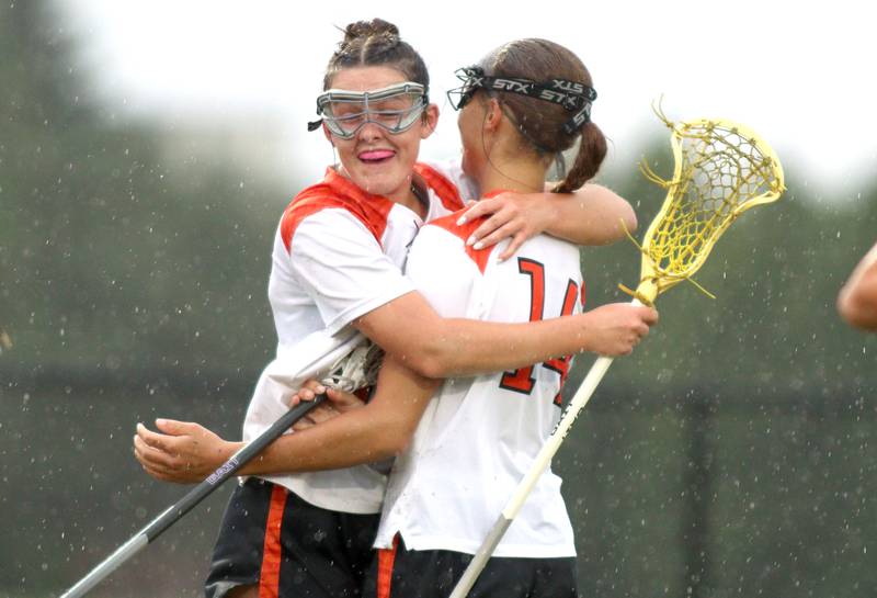 Crystal Lake Central’s Addison Bechler, right, is greeted by Colleen Dunlea after a Bechler goal  against Lake Forest during girls lacrosse supersectional action at Metcalf Field on the campus of Crystal Lake Central Tuesday.