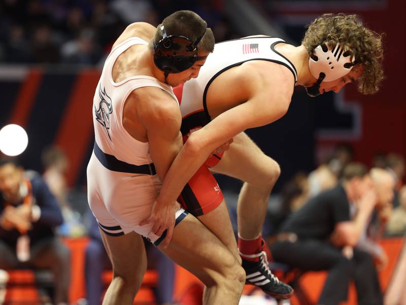 IC Catholic’s Deven Casey throws Glenwood’s Drew Davis in the 120-pound Class 2A state championship match on Saturday, Feb. 17th, 2024 in Champaign.