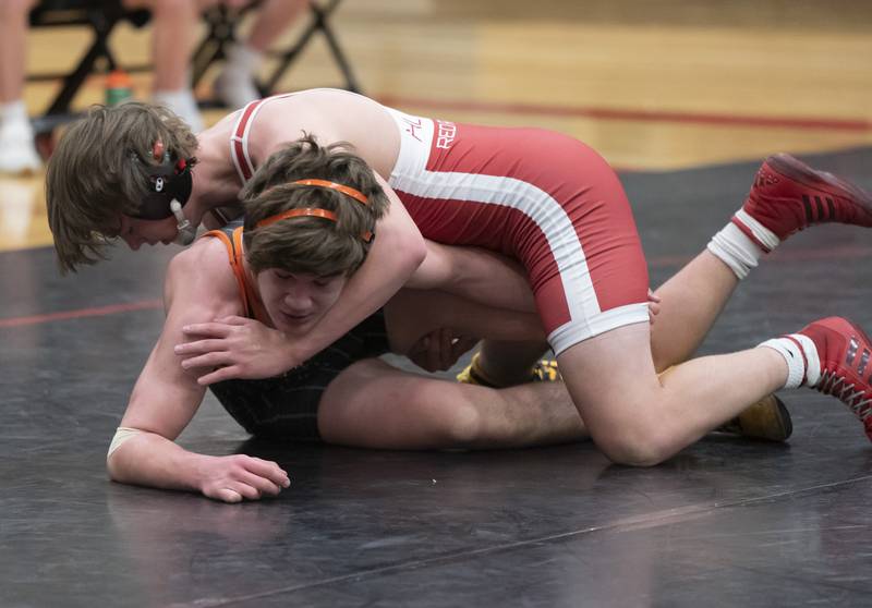 Huntley's Ryder Hunkins wrestles with Crystal Lake Central's Bennett Butler during the 182 pound match on Thursday, January 27, 2022 at Huntley High School.