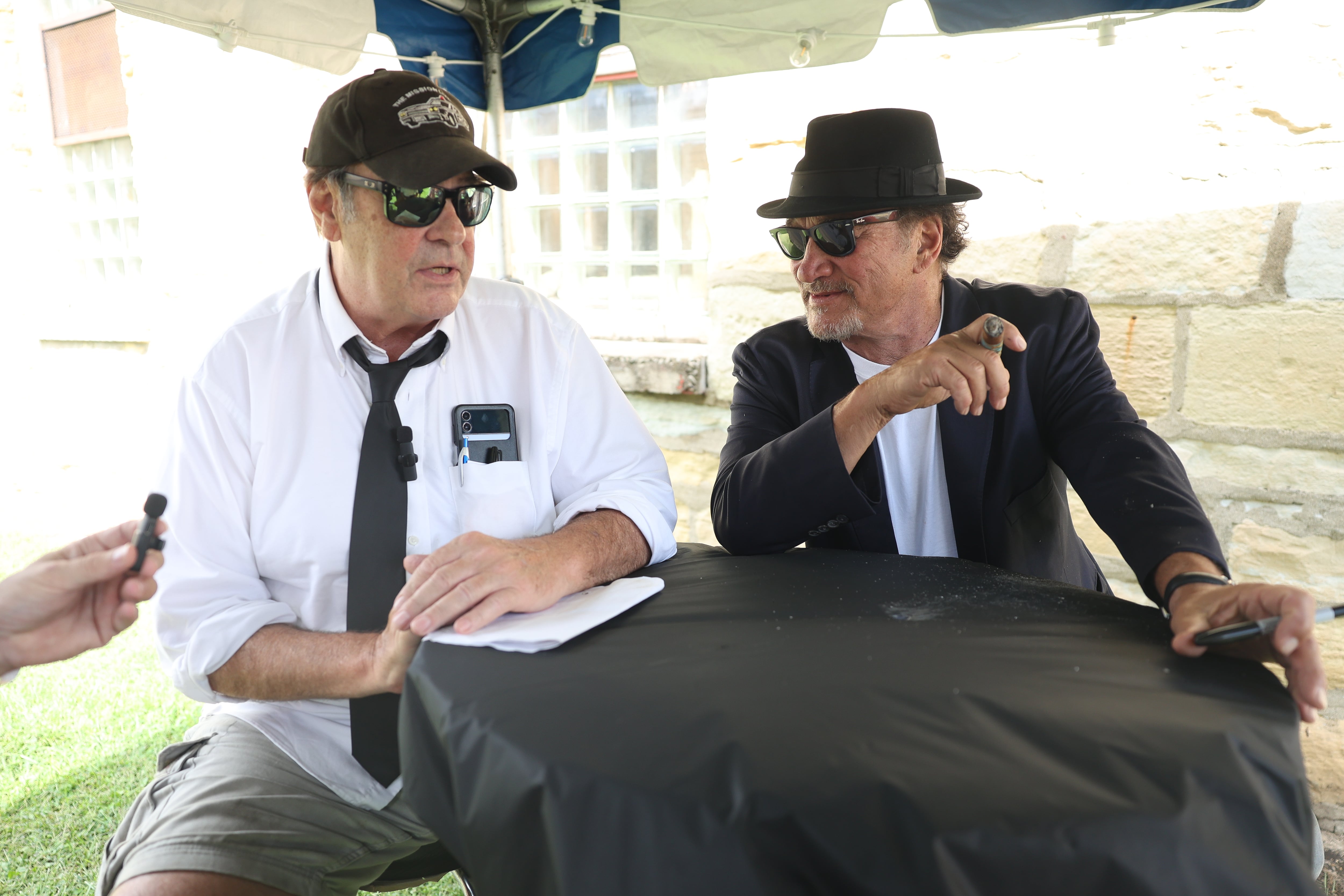 Dan Aykroyd and Jim Belushi talk with the press before their performance at Blues Brothers Con: The Sequel on Saturday, Aug. 17, 2024 at the Old Joliet Prison.