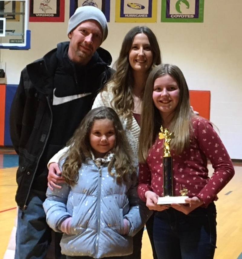Genoa Scripps Spelling Bee winner Alayna Johnson and her family.
