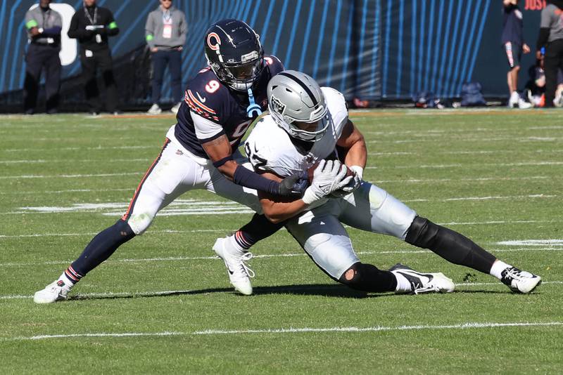 Chicago Bears safety Jaquan Brisker brings down Las Vegas Raiders tight end Michael Mayer during their game Sunday, Oct. 22, 2023, at Soldier Field in Chicago.