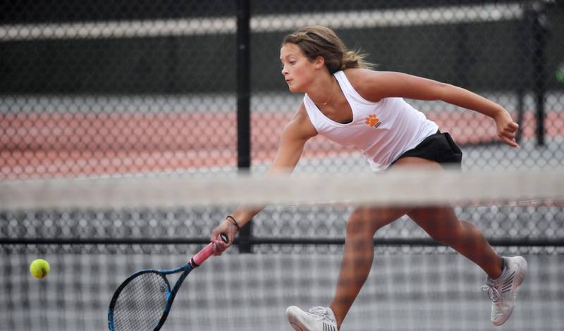 Wheaton Warrenville South’s Riley Lepsi returns a forehand against Geneva’s Corlett Klein in their singles match at the DuKane Conference girls tennis tournament at Wheaton Warrenville South High School on Thursday, October 5, 2023.