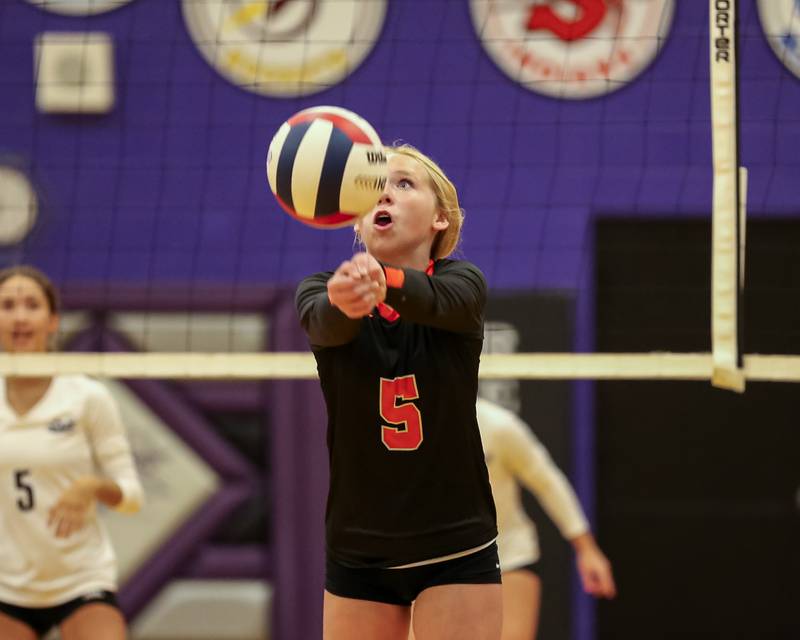 Sandwich's Jessica Ramey (5) eyes a dig save during volleyball match between Sandwich at Plano.  August 21, 2023.