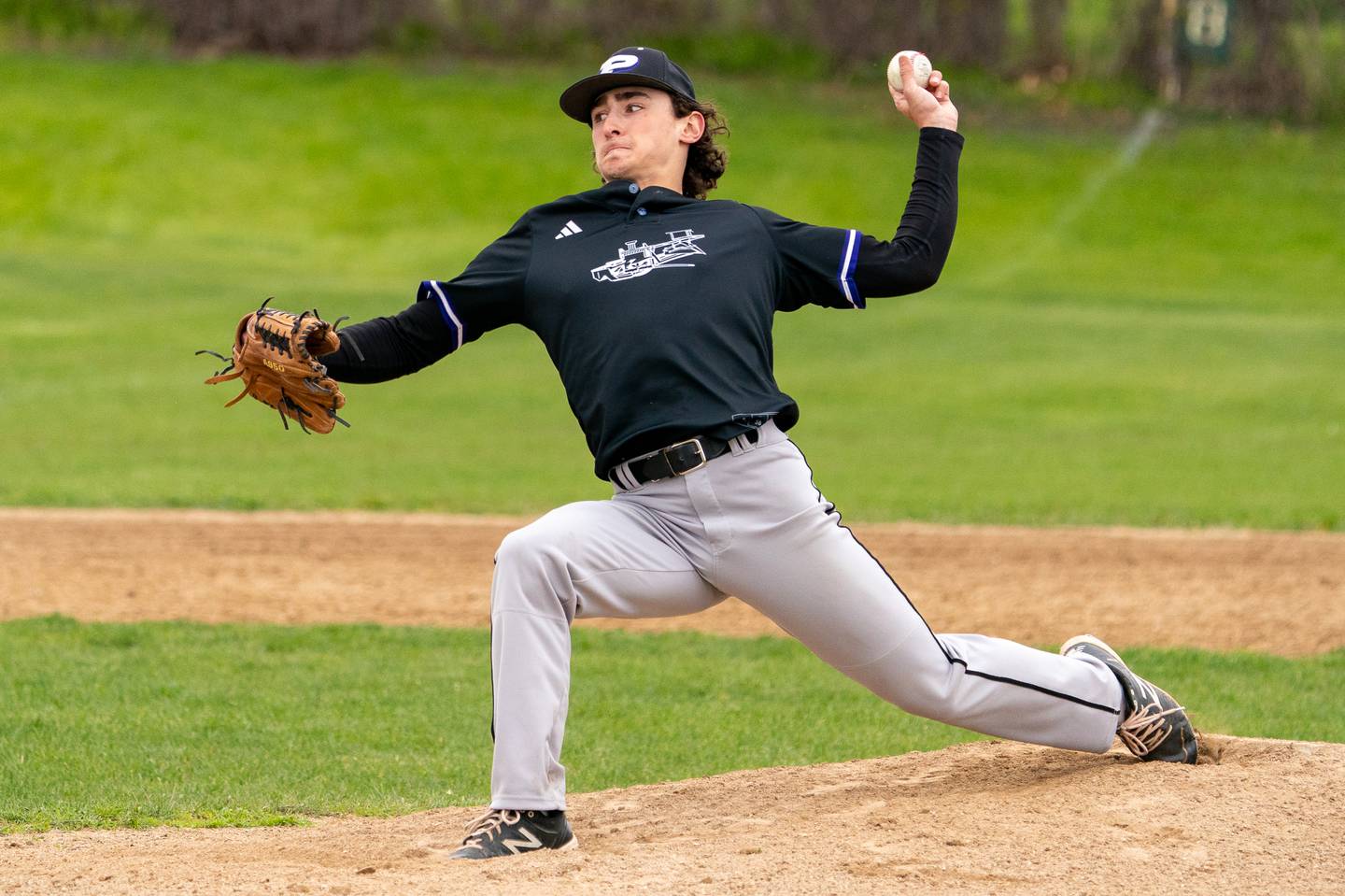 Plano's Kaden Aguirre (99) delivers a pitch against Sandwich during a baseball game at Sandwich High School on Monday, May 1, 2023.