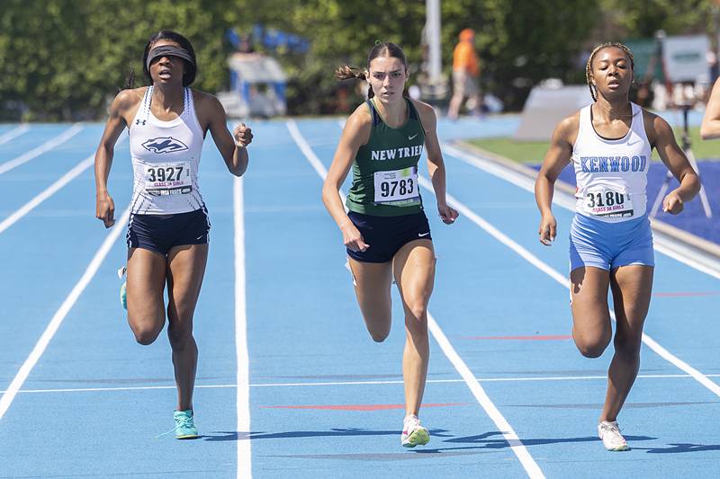 Plainfield’s Janhnel Bowman (left) eyes the finish in the 200 dash Saturday, May 18, 2024 at the IHSA girls state track meet in Charleston.