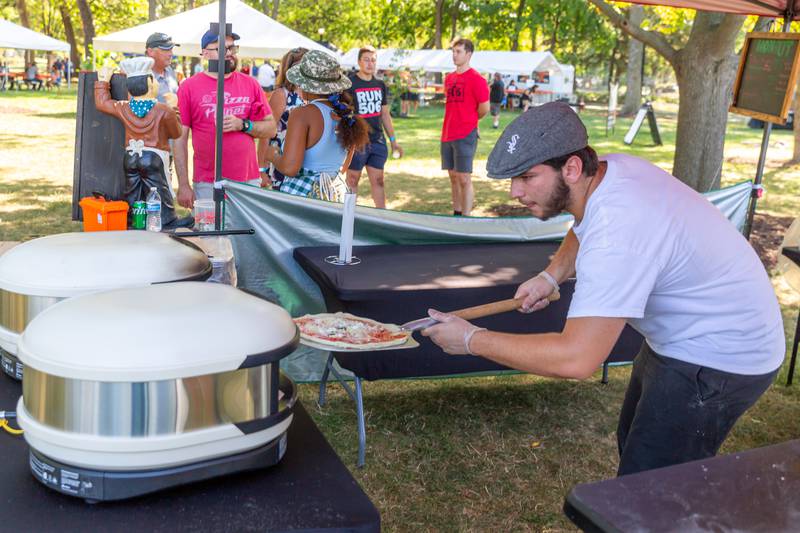 100nOut Pizza is loaded into the oven at the Berywn Brewfest. Sept 14, 2024 in Berwyn.