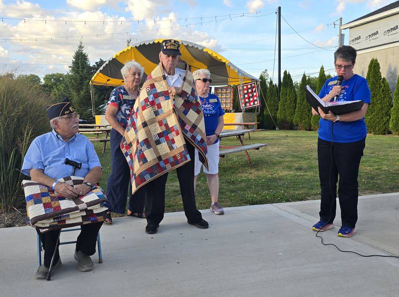 Leonard Wayne Lance is presented with a Quilt of Valor on Sunday, Sept. 15, 2024, at Senica Square in Oglesby, as Dominic Rivara, who also was honored, looks on.