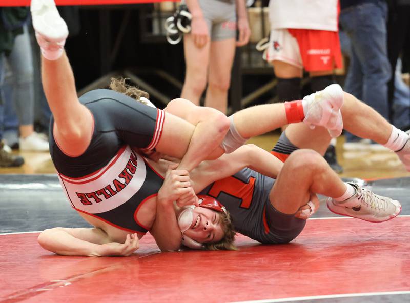 Yorkville's Jack Ferguson goes up against against Minooka's Cale Stonitsch during the Southwest Prairie Conference wrestling meet at Yorkville High School on Saturday, Jan. 21, 2023.