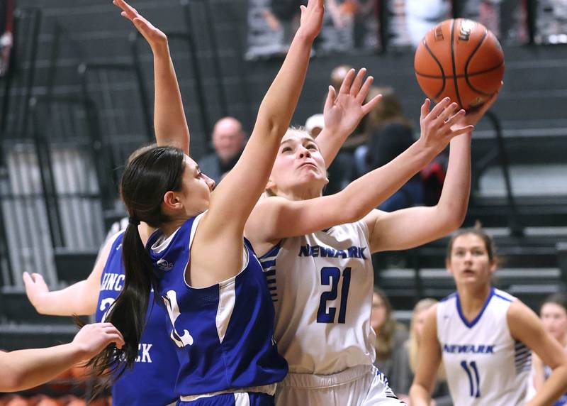 Newark’s Addison Ness goes to the basket against Hinckley-Big Rock's Lilliana Martinez Thursday, Jan. 18, 2024, during the Little 10 girls basketball tournament at Indian Creek High School in Shabbona.