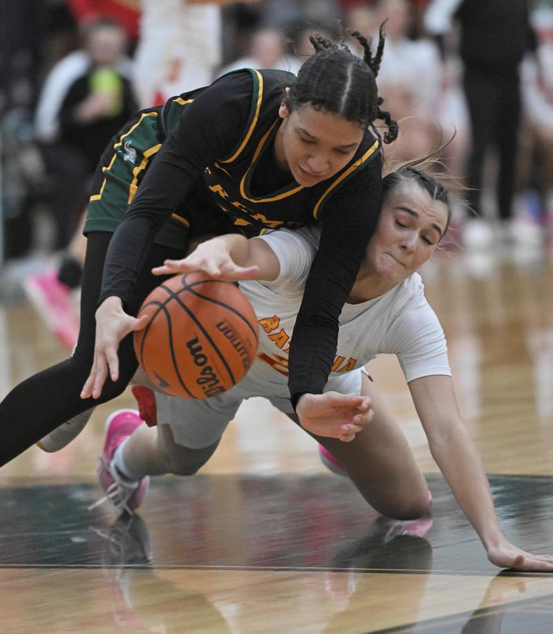Fremd’s Coco Urlacher and Batavia’s Brooke Carlson battle for the ball in the Bartlett supersectional game on Monday, Feb. 26, 2024.