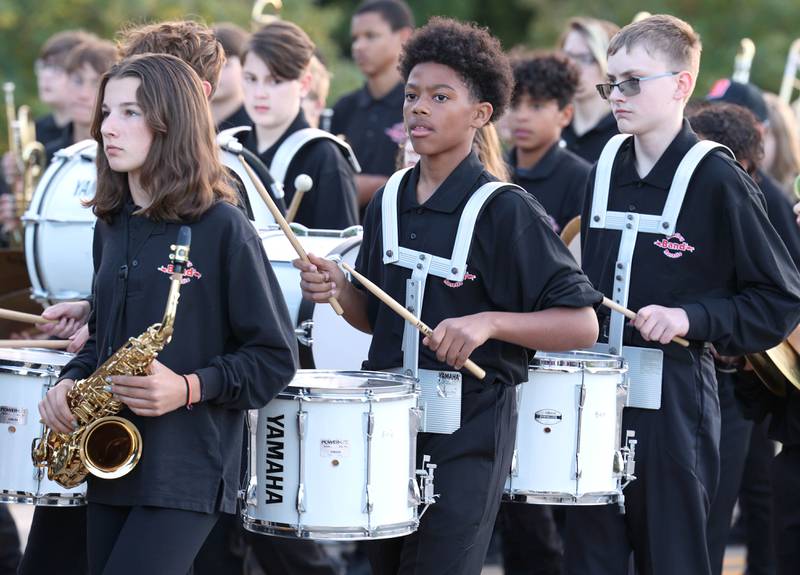 The middle school marching band, made up of students from a combination of the two Middle Schools in DeKalb, heads down Dresser Road Wednesday, Oct. 5, 2022, during the high school's homecoming parade.