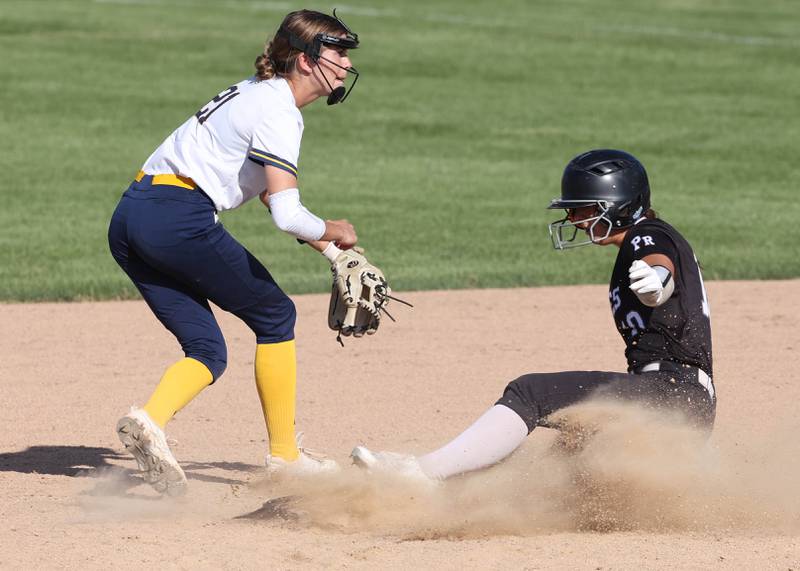 Prairie Ridge's Emily Harlow slides in safely to second in front of Sterling's Kaity Taylor during their Class 3A sectional semifinal game Wednesday, May 29, 2024, at Sycamore High School.