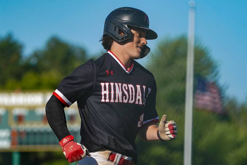 Hinsdale Central's Luke Jurack (9) rounds third base after hitting a three run homer against Oswego during a Class 4A Waubonsie Valley Regional semifinal baseball game at Waubonsie Valley High School in Aurora on Wednesday, May 22, 2024.