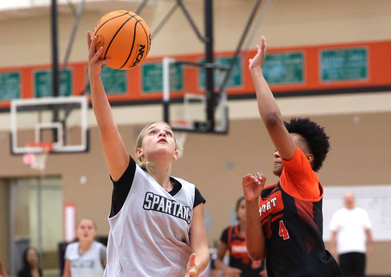 Sycamore’s Quinn Carrier goes to the basket during their summer game against Freeport Monday, June 17, 2024, at DeKalb High School.