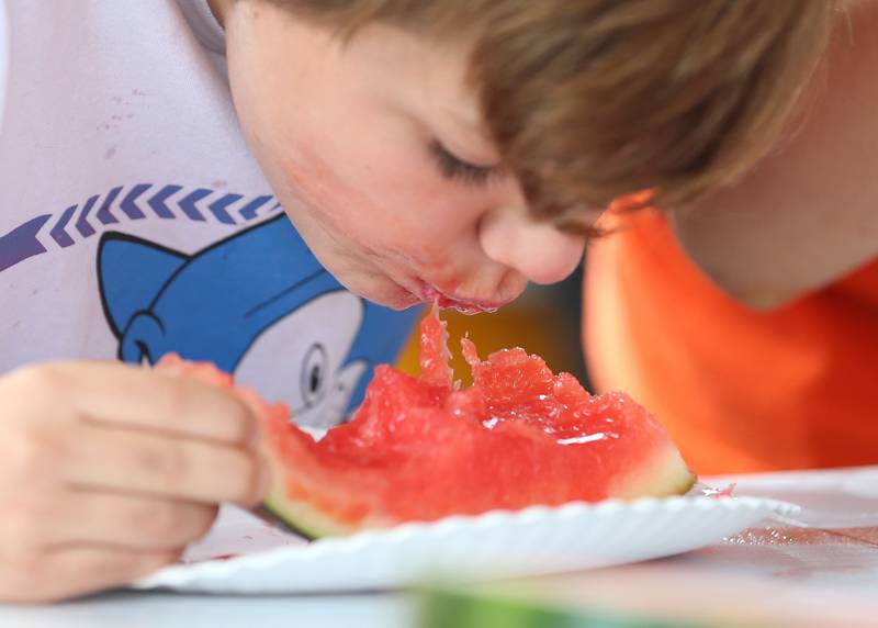 Theo Shalter of Ottawa, munches on watermelon for the watermelon eating contest during the La Salle County 4-H Fair on Thursday, July 11, 2024 in Ottawa.