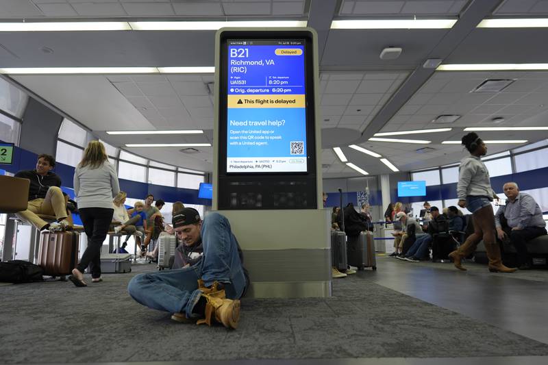 An information display near United gates shows a flight delay at Chicago O'Hare International Airport in Chicago, Friday, July 19, 2024, after software issues delayed and canceled flights globally. (AP Photo/Carolyn Kaster)