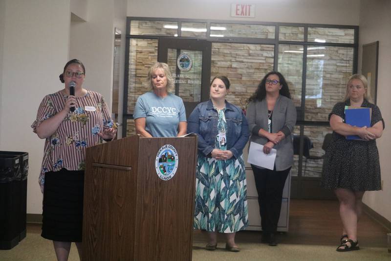 Samantha McDavid (left), coordinator of early learning programs at the DeKalb County Regional Office of Education, speaks at the annual kindergarten readiness community forum June 27, 2024, at the Community Outreach Building in DeKalb.
