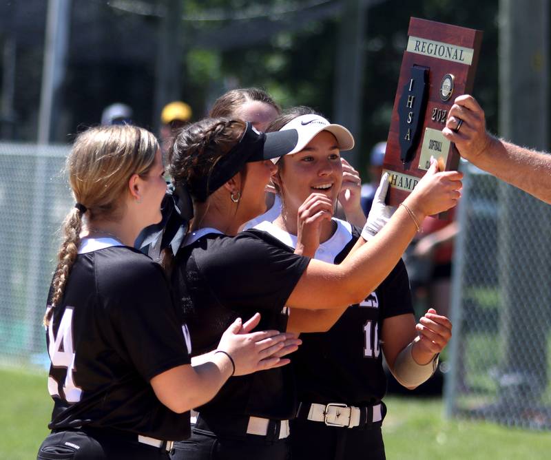 Prairie Ridge’s Wolves celebrate  a win over Harvard during Class 3A softball regional final action at Lions Park in Harvard Saturday.