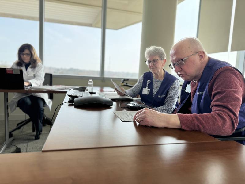 Larry and Teri Bobko make calls to stroke survivors with Jennifer Cote, MSN, APRN, FNP-BC, Wood-Prince Family Stroke Program coordinator at Lake Forest Hospital. The couple has donated more than 250 hours of service at LFH over the past six years.