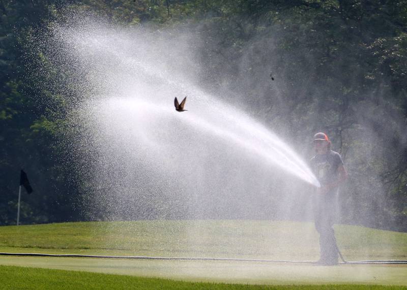 Gino Valle waters the 18th hole at Seneca's Deer Park Golf Course as a bird flies through the stream on Friday, June 23, 2023. Irrigating a golf course during a drought takes a lot of water to maintain the greens. As of Thursday, the U.S. Drought monitor listed the southern half of Bureau and La Salle Counties under a severe drought. All of Putnam County is in a severe drought. During this stage, agriculture is hurting with row crop and vegetable conditions are poor. Water levels in ponds, wells, rivers, lakes, ponds remain at low levels along with below average streamflow. Outdoor burn bands are also implemented.