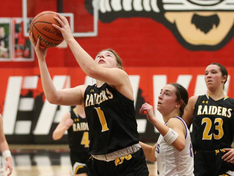 Ashton-Franklin Center's Alexis Schwarz eyes the hoop as Serena's Makayla McNally defends during the Class 1A Regional final on Thursday, Feb. 15, 2024 at Earlville High School.