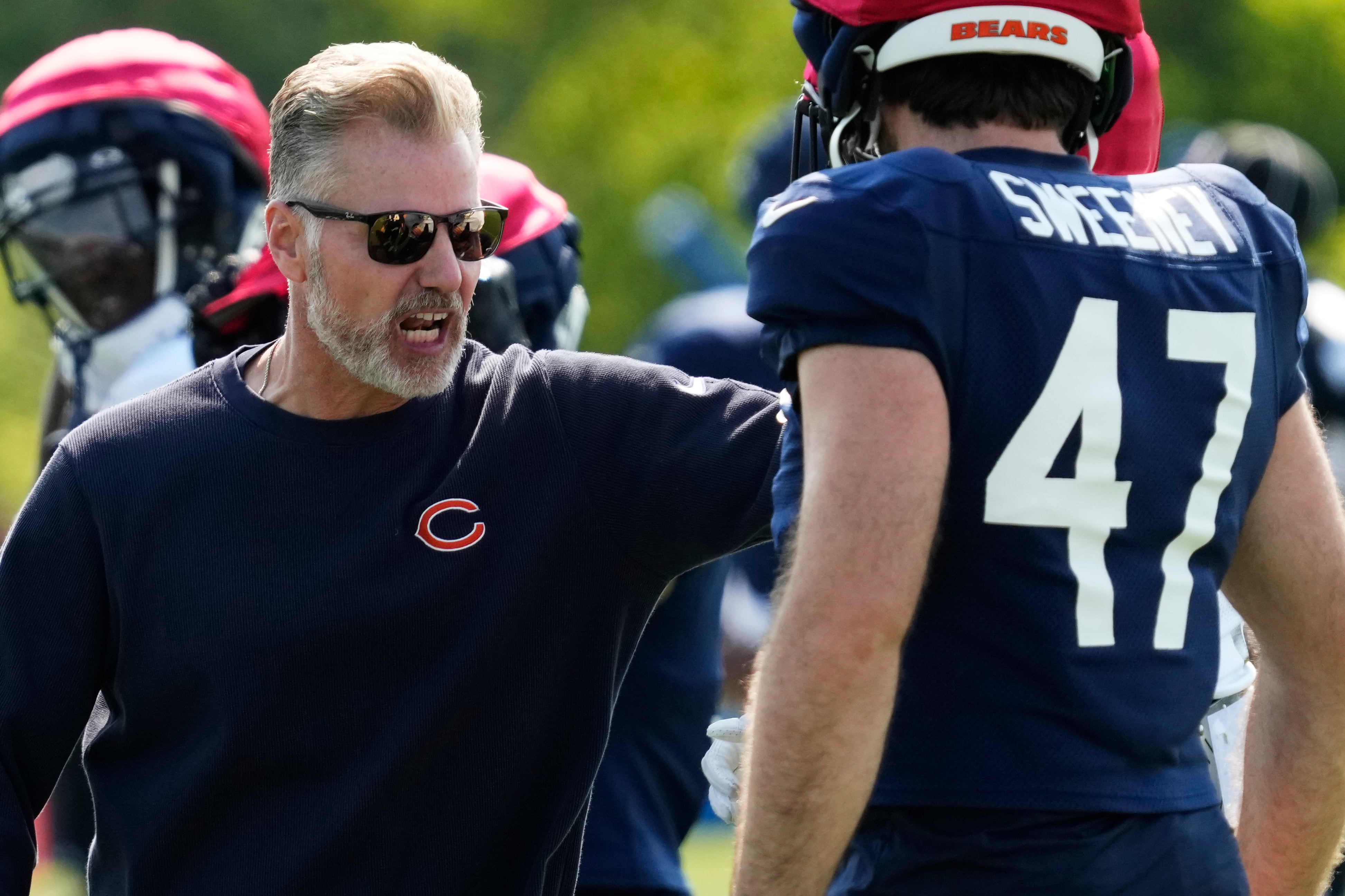 Chicago Bears head coach Matt Eberflus talks to players during an NFL football training camp practice in Lake Forest, Ill., Thursday, Aug. 8, 2024. (AP Photo/Nam Y. Huh)