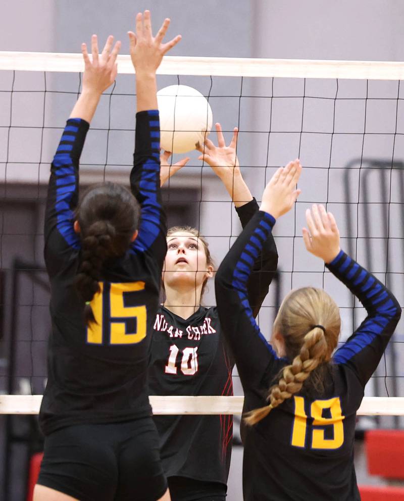 Indian Creek's Audrey Witte tries to send the ball between two Somonauk players during their regional first round match Tuesday, Oct. 25, 2022, at Aurora Christian High School in Aurora.