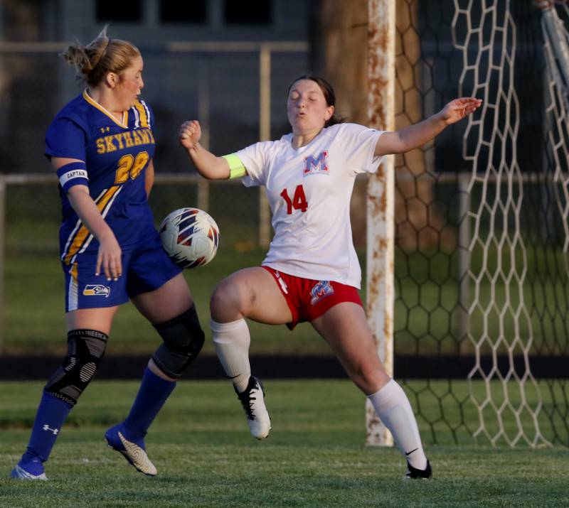 Johnsburg's Mackenzie McQuiston tries to direct the ball towards the goal past Marian Central'a Knapp Mia during the IHSA Class 1A Marengo Regional championship soccer match on Tuesday, May 14, 2024, at Marengo High School.